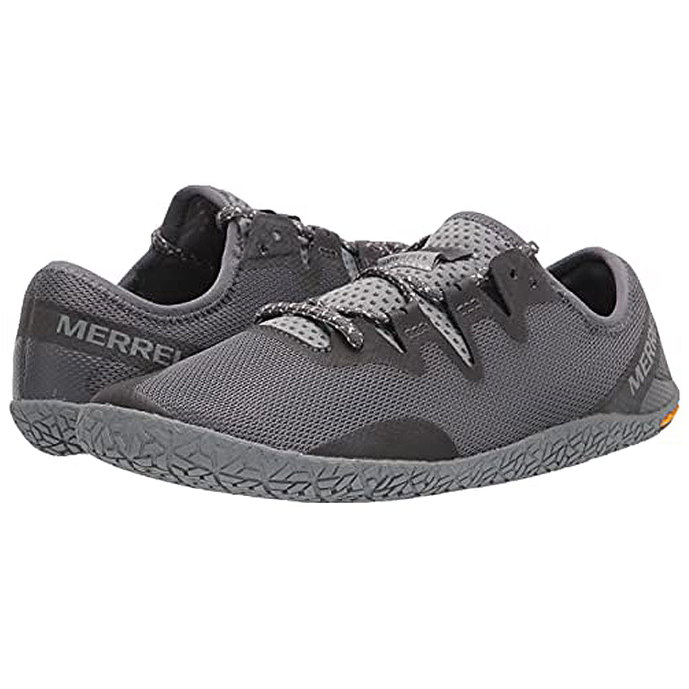 A pair of Merrell Vapor Glove 5 - Men minimalist shoes in gray, featuring mesh uppers from recycled materials, textured rubber soles, and black accents. One shoe stands upright; the other is angled to display its side and heel.