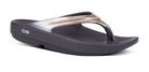 The OOFOS OOlala Luxe Sandal for women in Latte has a thick sole, ergonomic footbed, and features OOfoam technology for outstanding comfort.