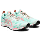 A pair of womens GEL-NOOSA TRI 12 ASICS running shoes in light teal and pink with mesh uppers, pink-and-white laces, patterned soles, black rubber outsoles, and a responsive FLYTEFOAM midsole for comfort.