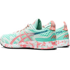 A pair of ASICS GEL-NOOSA TRI 12 - Womens running shoes with a teal mesh upper, light pink accents, and a multicolor pink, white, and teal sole featuring FLYTEFOAM midsole, shown from the side and back.