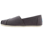 A single ash gray TOMS Alpargata ESP slip-on canvas shoe with a flat white sole, viewed from the side on a white background, showcases TOMS’ signature design and their buy one give one promise.
