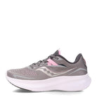 The Saucony Ride 15 - Womens in Alloy/Quartz is a gray running shoe with light pink and white accents, featuring a breathable mesh upper, lace-up closure, and thick white PWRRUN cushioning for comfort.