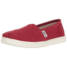 The TOMS Alpargata ESP - Women is a red slip-on shoe with a white rubber sole and side tag. Featuring the classic canvas design, each purchase supports TOMS buy one give one promise for simple, casual everyday style.