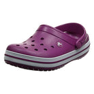 The Crocs Crocband Clog Seasonal Colors - Unisex in viola features ventilation holes, a white and gray striped sole, and an adjustable heel strap—now available.