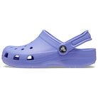 A single Crocs Classic Clog - Kids shoe in Digital Violet, featuring ventilation holes and an adjustable heel strap, is shown in a side profile view against a white background.