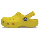 A Lemon Classic Clog - Kids by Crocs is displayed in a side view on a white background, featuring ventilation holes, a textured sole, and an adjustable heel strap.