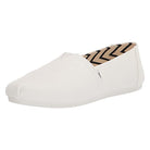 The TOMS Alpargata - Womens in White Canvas is a slip-on with a rounded toe, subtle stitched details, and a black and beige chevron inner lining made from recycled cotton.