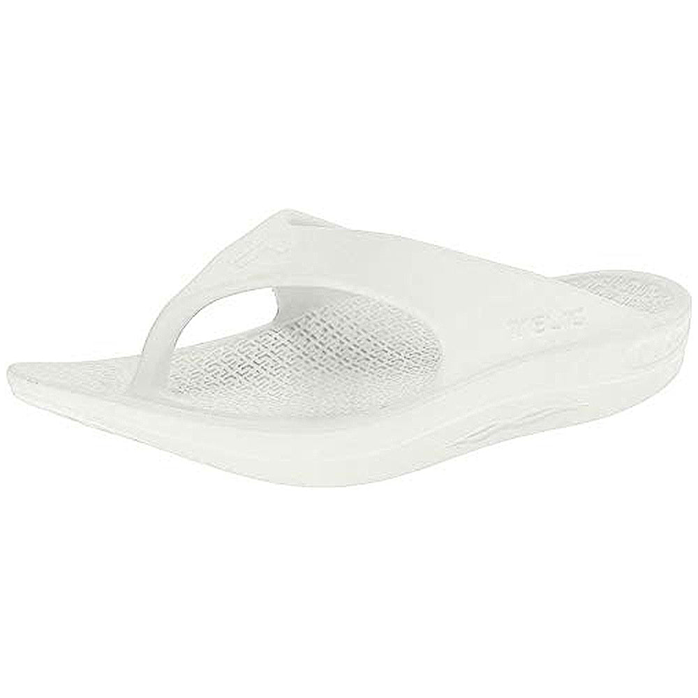 A single Telic Footwear Energy Flip Flop - Unisex sandal in Snow White features pillow-soft cushioning, a textured footbed, arch support, and a slightly elevated sole, shown at an angled front-right view.
