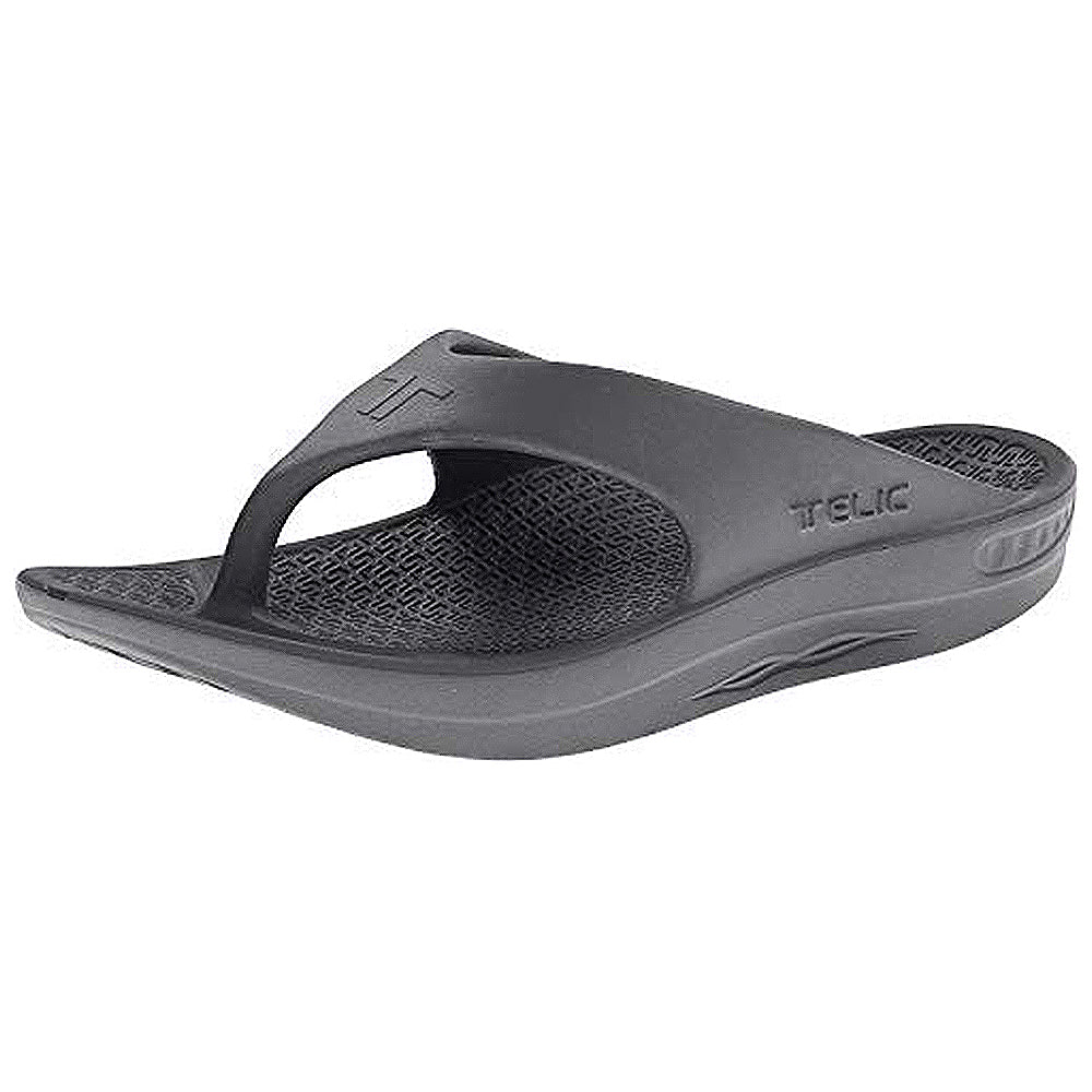 A dolphin grey, ergonomic Telic Footwear Energy Flip Flop - Unisex sandal featuring pillow-soft cushioning, a textured footbed, thick sole, simple thong design, excellent arch support, and embossed brand logo on the side.