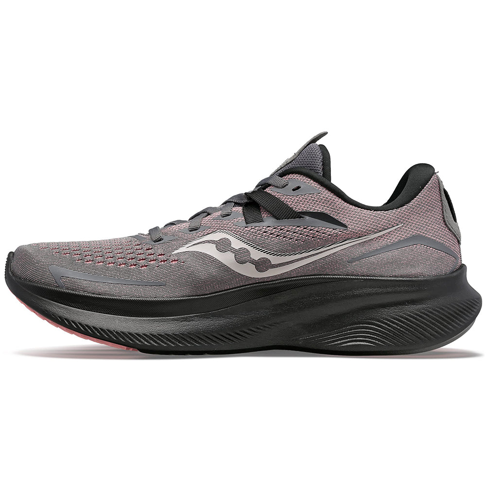 The Saucony Ride 15 - Womens in Charcoal/Shell features a mesh upper, black laces, a white wavy logo, and a thick textured black sole with PWRRUN cushioning. The shoe is shown in profile, facing left.
