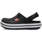 The Crocs CrocBand Clog - Unisex in black features a white and black striped sole, ventilation holes, an adjustable heel strap, lightweight cushioning, and a small red Crocs logo near the ankle.