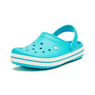 The Crocs Crocband Clog Seasonal Colors - Unisex in Digital Aqua features ventilation holes, a white and blue striped sole, and an adjustable heel strap. Displayed on a white background—where comfort meets style for everyone.