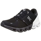 The On Cloudflyer 4 - Men in Black | White features mesh fabric, Helion superfoam cushioning, CloudTec® sole technology, a secure lace-up closure, and displays the ON logo on the side.