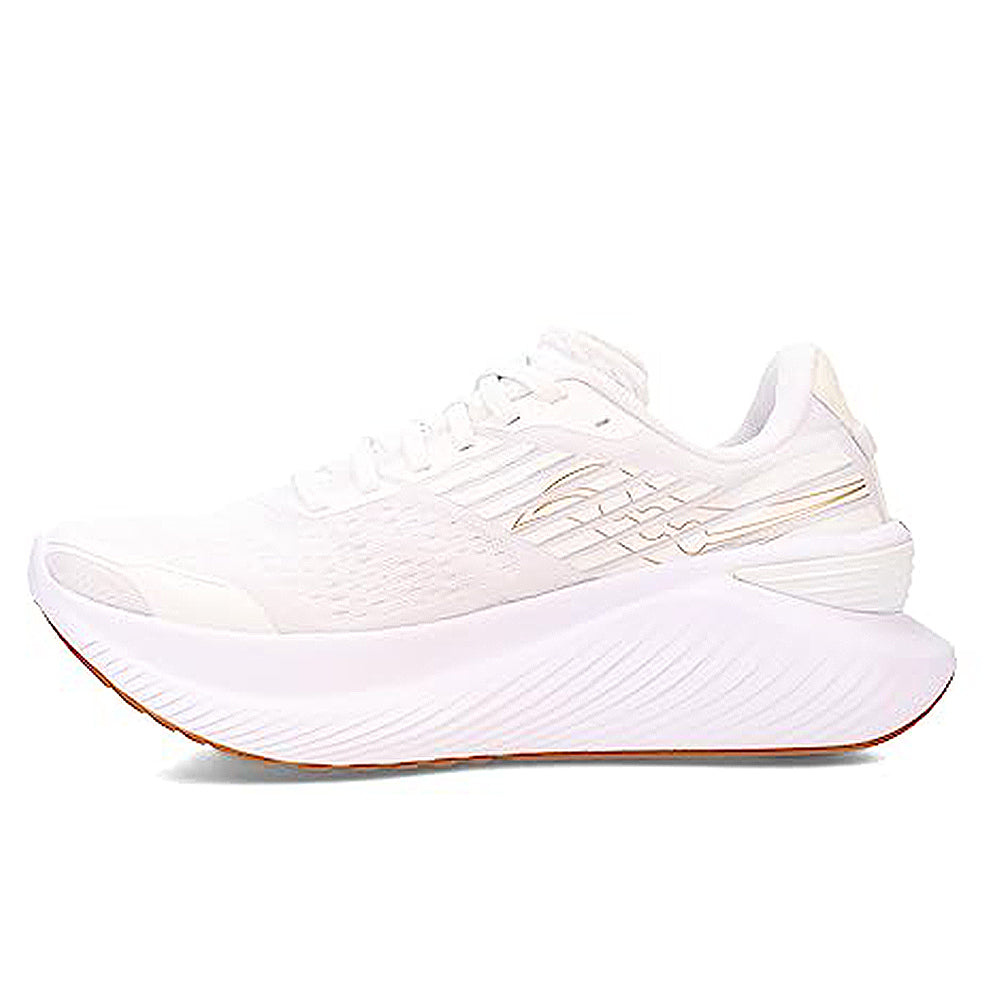 The Saucony Guide 16 Running Shoe - Womens in White/Gum features a textured sole, cushioned support, light gold accents, and a modern design, shown in side profile against a plain white background.