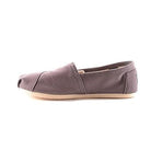 The TOMS Classic Canvas - Men in Grey features a casual alpargata design with a light-colored flat sole, shown in profile against a white background.