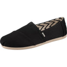 A single TOMS Alpargata - Womens slip-on in Black Canvas from the earthwise collection, with recycled cotton, a beige sole, and a zigzag inner lining, is angled to show the front side.