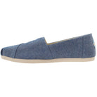 A single TOMS Alpargata ESP - Women slip-on in Blue Slub Chambray with a beige rubber sole, shown from the side on a white background—featuring the brands iconic buy one give one philosophy and classic slip-on design.