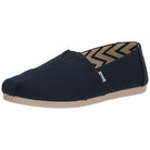The TOMS Alpargata - Women’s in Navy Canvas features a recycled cotton upper, beige rubber sole, zigzag-patterned lining, rounded toe, and a small side fabric tag.