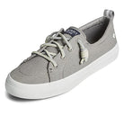 The Sperry Crest Vibe - Womens sneaker in grey features a minimalist canvas design, white rubber sole, light grey laces, and a fabric logo tag on the tongue. Enjoy subtle style and comfortable arch support for daily wear.