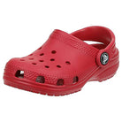 The Crocs Classic Clog - Kids in Pepper features a single red clog-style shoe with top ventilation holes and a pivoting heel strap, combining playful comfort and iconic Crocs design.