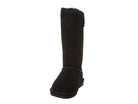 The BEARPAW Lori Boots - Womens is a black suede boot with a flat sole, mid-calf height, visible stitching, and soft sheepskin wool lining at the top for extra warmth and comfort.