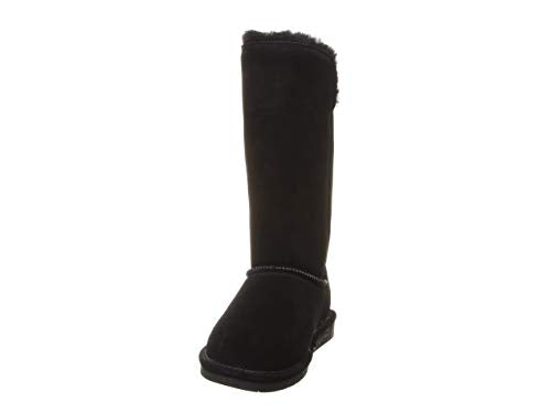 The BEARPAW Lori Boots - Womens is a black suede boot with a flat sole, mid-calf height, visible stitching, and soft sheepskin wool lining at the top for extra warmth and comfort.