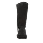 Front view of the BEARPAW Tamara Boots for women, featuring tall black suede, a flat sole, and fringe detailing on one side—showcasing the brand’s signature style.