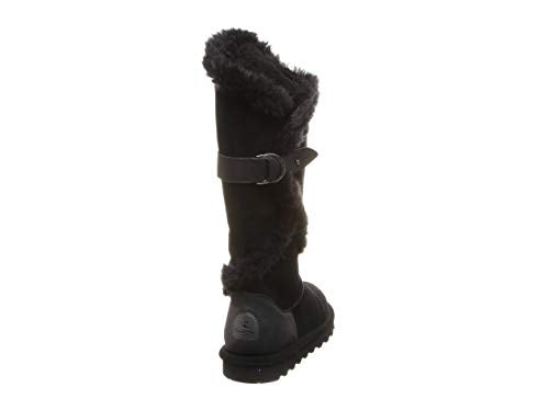The BEARPAW Sheilah Boots for women are black suede mid-calf boots with a furry trim, decorative side buckle, and thick rubber sole, shown from the back at a slight angle.