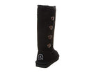The BEARPAW Lori Boots for women are tall black suede boots featuring four side buttons, a plush sheepskin wool lining, and a small heel label with a white logo, shown from the rear side angle.