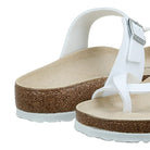 A close-up of the Birkenstock Mayari Oiled Leather sandals for women showcases white adjustable straps, cork soles, a contoured footbed, textured outsole, and premium comfort.