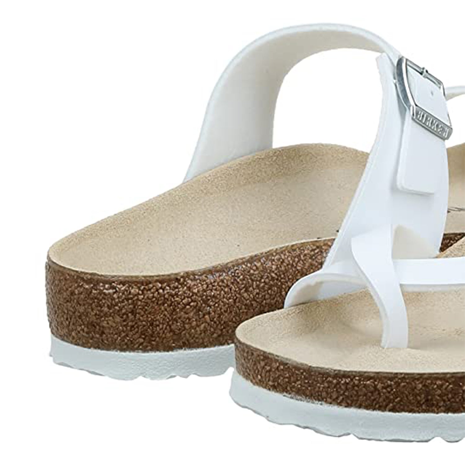 A close-up of the Birkenstock Mayari Oiled Leather sandals for women showcases white adjustable straps, cork soles, a contoured footbed, textured outsole, and premium comfort.