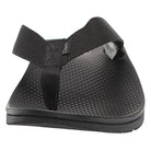 The Chaco Classic Flip - Men sandal in black is shown from the front, featuring wide straps, a textured footbed, flat sole, and durable ChacoGrip rubber outsole on a plain white background.