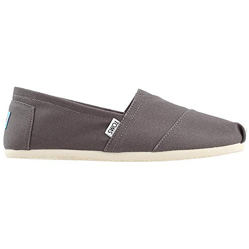 A single gray TOMS Alpargata ESP - Women slip-on with a white sole, shown from the side. Features subtle stitching, classic slip-on design, TOMS label, and supports the brand’s buy one give one mission.