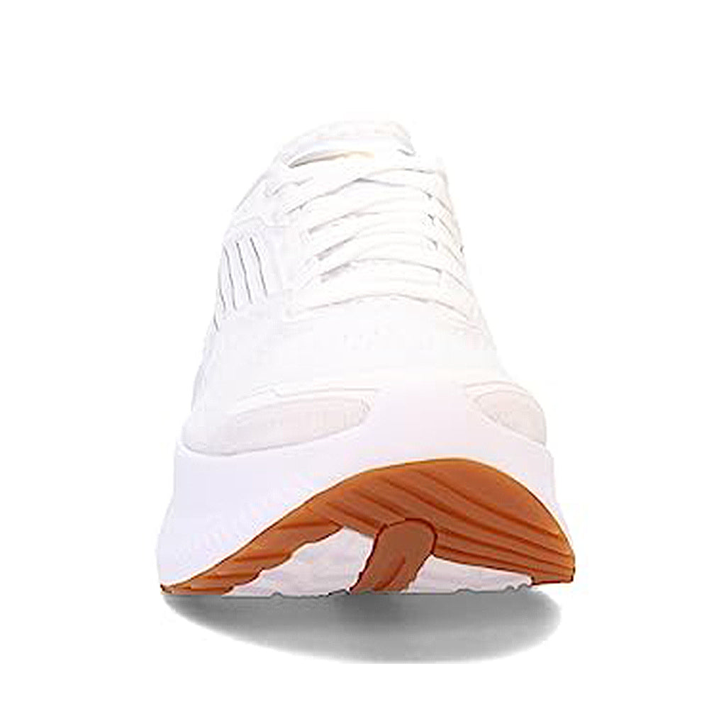 A front view of the Saucony Guide 16 Running Shoe - Womens, showing white laces, cushioned support, and a thick white sole with a brown rubber bottom section. The shoe is white and set against a plain white background.