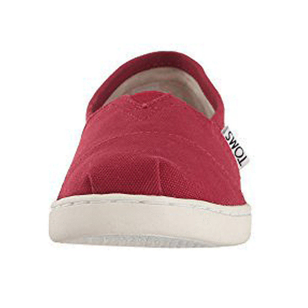 Front view of a red TOMS Alpargata ESP slip-on canvas shoe for women with a white rubber sole and small white label, highlighting TOMS signature buy one, give one program.