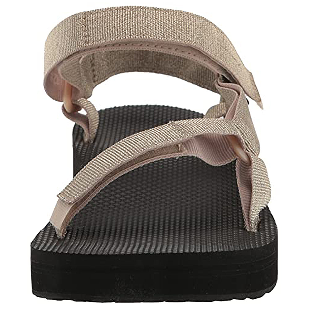 A close-up of the Teva Midform Universal - Womens sandal shows beige fabric straps, a textured black sole, open heel, and adjustable water-ready straps from the back.