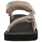 A close-up of the Teva Midform Universal - Womens sandal shows beige fabric straps, a textured black sole, open heel, and adjustable water-ready straps from the back.
