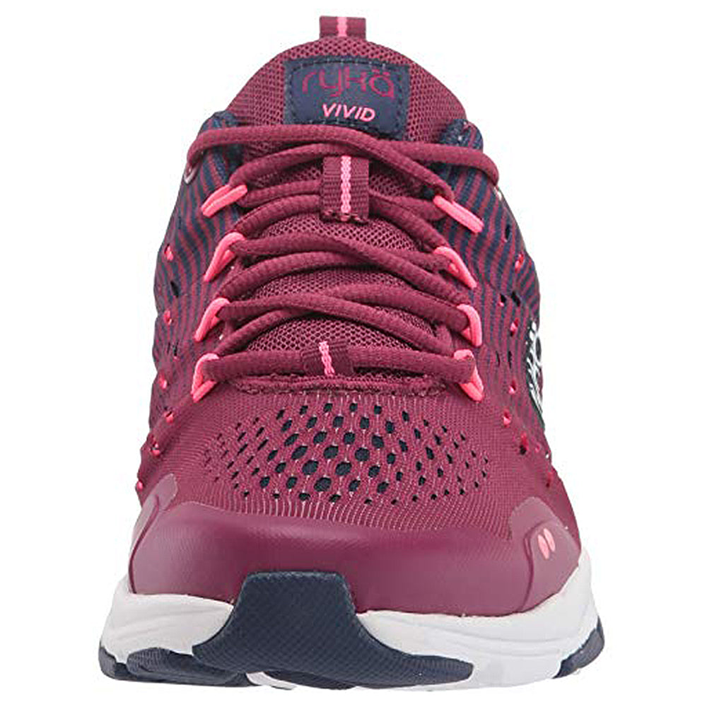 The Ryka Vivid RZX - Women is a magenta athletic shoe with pink laces, mesh upper, and white sole, featuring the Ryka logo on the tongue. Versatile for cross-training or water fitness, it’s an ideal women’s water sneaker.