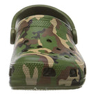 A front view of the Crocs Classic Camo Clog - Unisex, a green slip-on shoe with a camouflage pattern, ventilation holes, textured toe, and pivoting heel strap—ideal for comfortable water wear.
