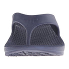 A close-up front view of a single Telic Footwear Energy Flip Flop - Unisex in navy blue, with arch support, a textured footbed, and thick upper strap, displayed on a white background.