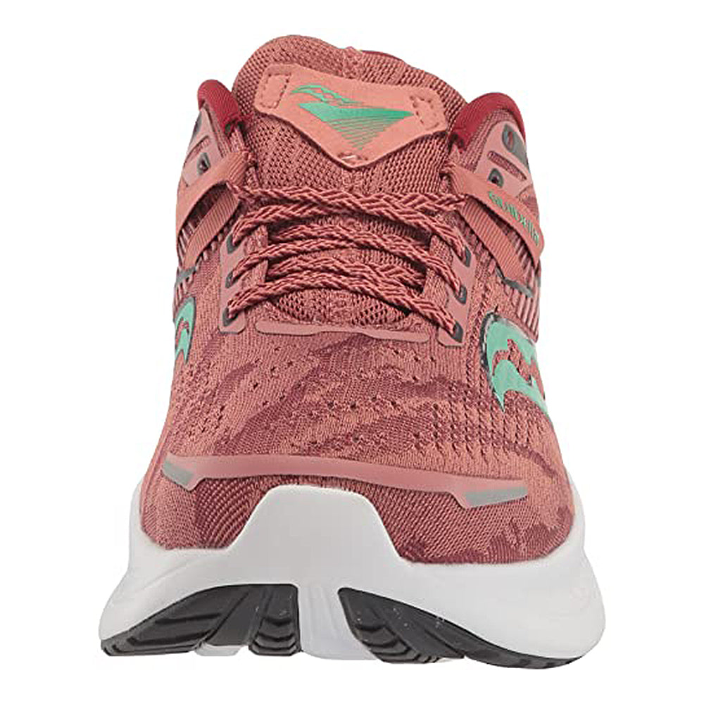 Front view of the Saucony Guide 16 Running Shoe - Womens in pink and coral with teal accents and a white sole, showcasing laces, tread pattern, and cushioned support for every stride.