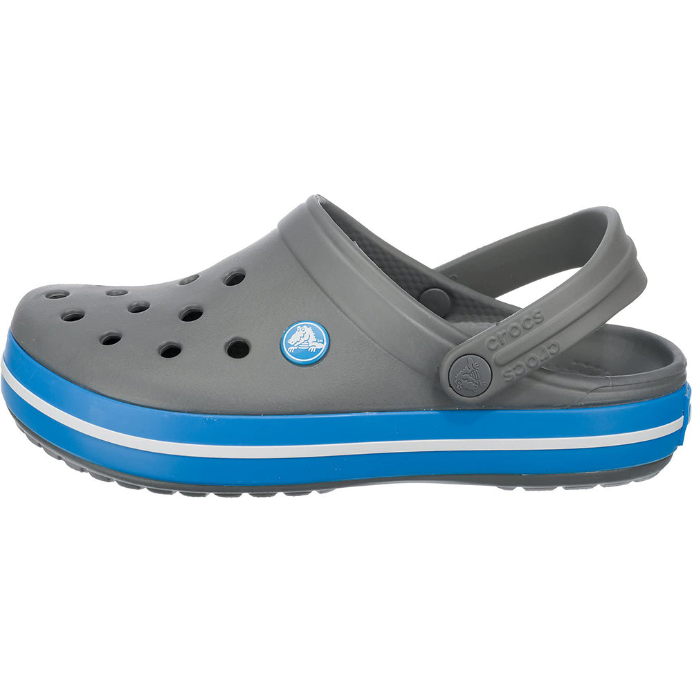 The Crocs Crocband Clog Seasonal Colors - Unisex, featuring ventilation holes, a blue and white striped sole, and an adjustable heel strap, is available in gray.