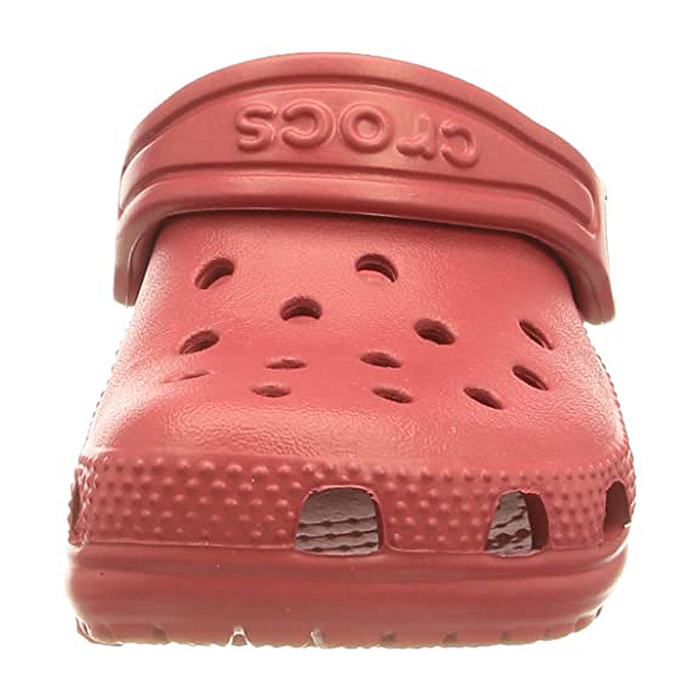 Front view of a red Crocs Classic Clog for kids, featuring ventilation holes on top and Crocs embossed on the adjustable heel strap.