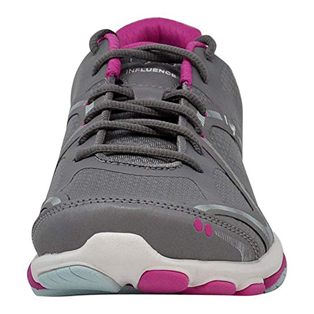 The Ryka Influence - Women cross-trainer in gray features pink and white accents, shown from the front to highlight its laces, toe, and sole tread pattern.