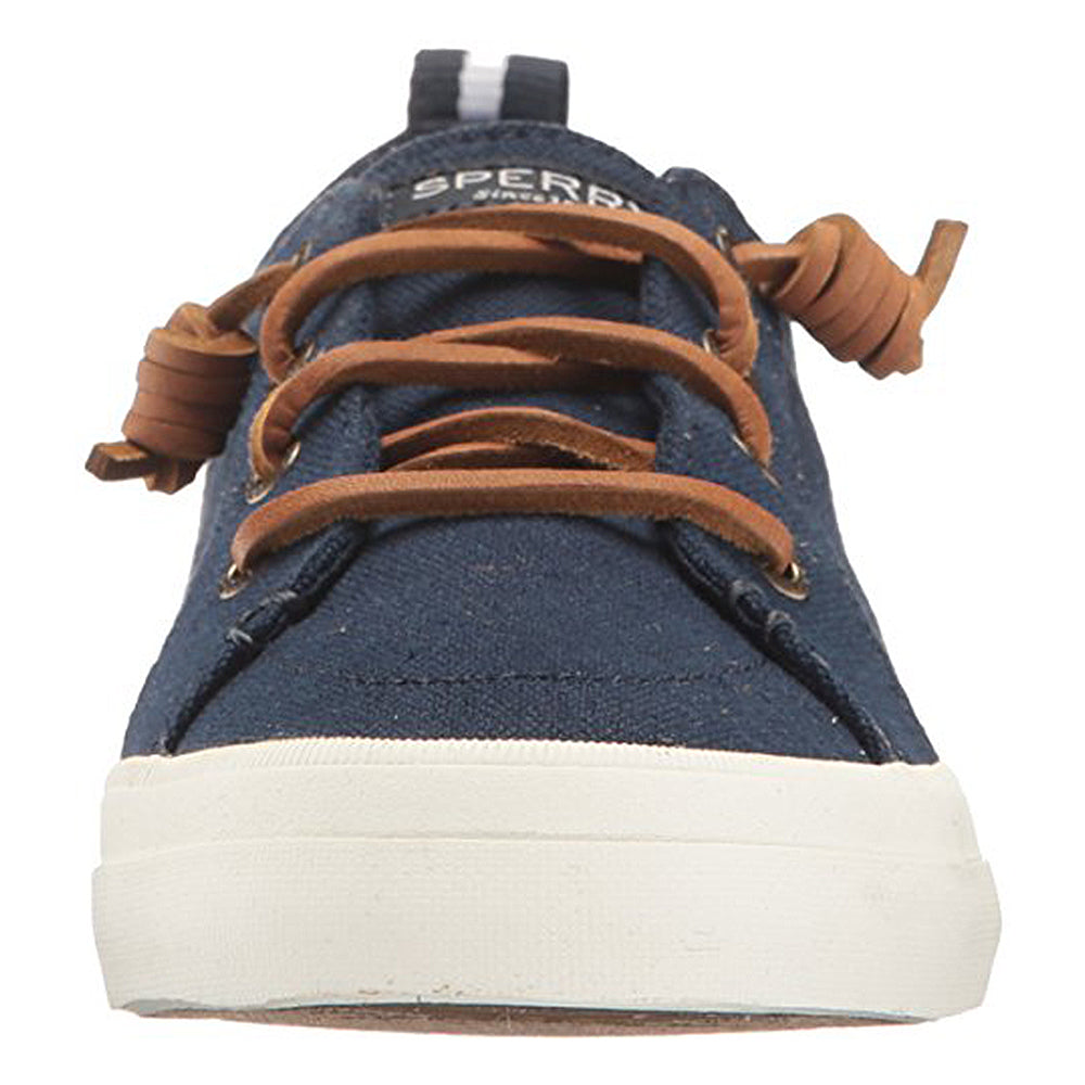A front view of Sperry Crest Vibe - Womens sneaker in durable navy blue, featuring brown leather knot laces, a white rubber sole, SPERRY branding on the tongue, and comfortable arch support.