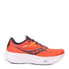 The Saucony Ride 15 - Womens is a bright orange running shoe with navy and white accents, breathable mesh upper, navy laces, and a thick white PWRRUN cushioning sole.