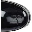Close-up of the shiny black toe on the Hunter Original Short Gloss Rain Boots for women, highlighting light reflections and a textured gray sole.