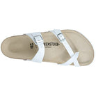 The Birkenstock Mayari Oiled Leather sandal for women features a white oiled leather upper, two adjustable silver buckles, and a beige contoured footbed, shown from an overhead view.