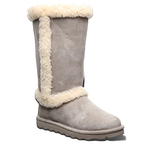 A single BEARPAW Kendall womens boot in light gray suede, featuring creamy shearling trim at the top, side, and ankle, plus a flat ridged sole—a cozy choice for strolls by Lake Tahoe.