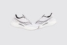 A pair of Saucony Endorphin Speed 3 Running Shoe - Womens, featuring white uppers with black accents and a gray logo, are displayed side by side on a plain light gray background—ideal for daily runs.